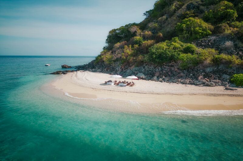 remote beach in Indonesia by private phinisi yacht charter