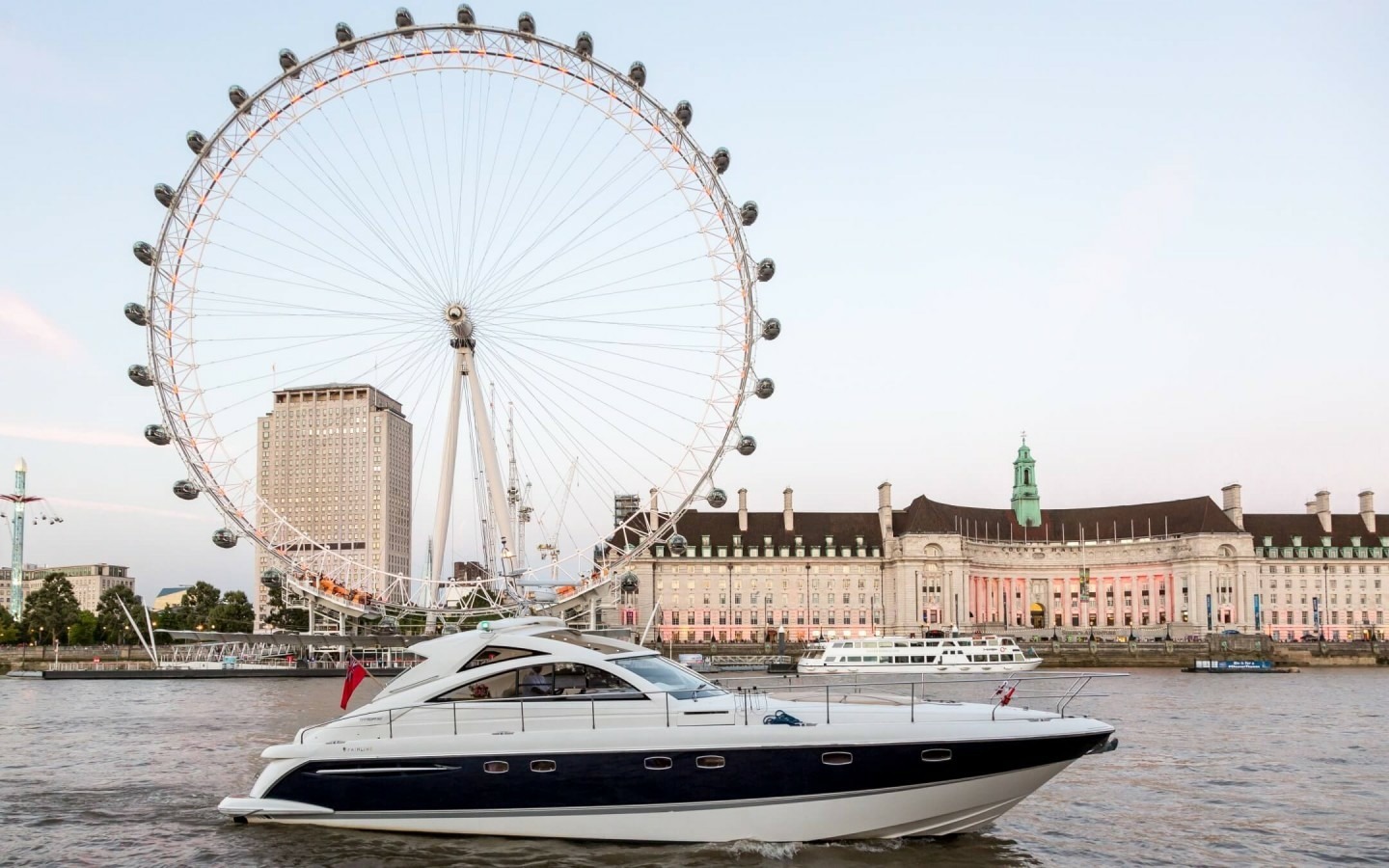 Luxury boat hire London with champagne and fine dining onboard