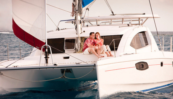 couple-sitting-front-deck-catamaran.jpeg